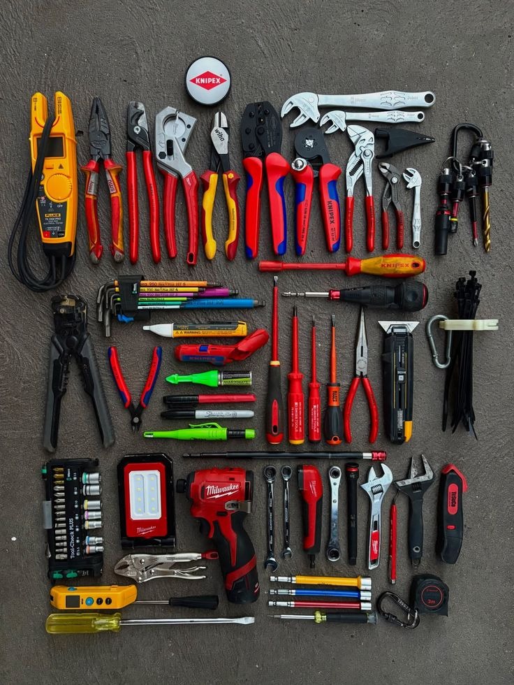 Comprehensive precision electrical and mechanical maintenance tool kit laid out systematically